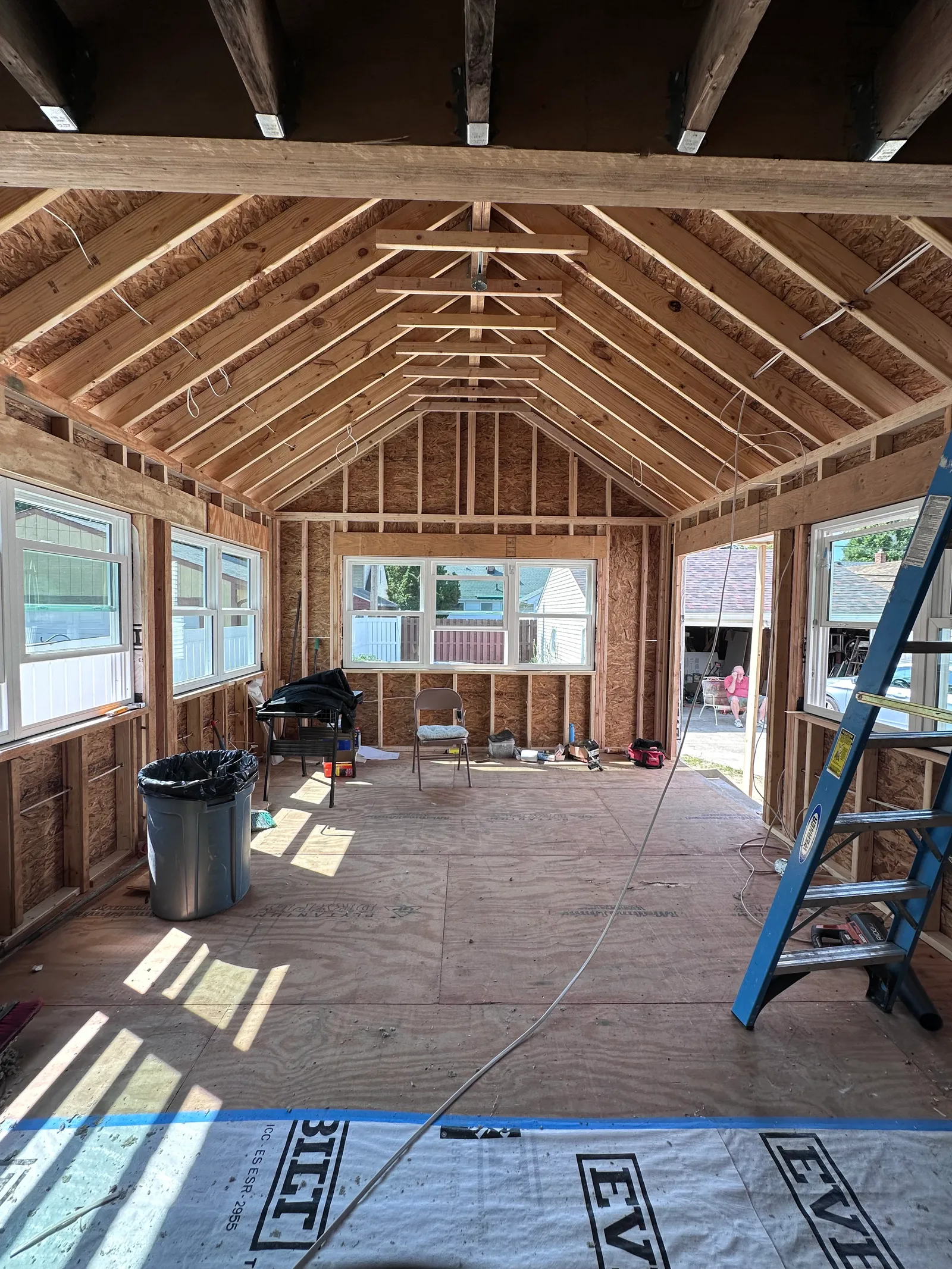 Addition framing with house wrap sheathing and window rough-ins