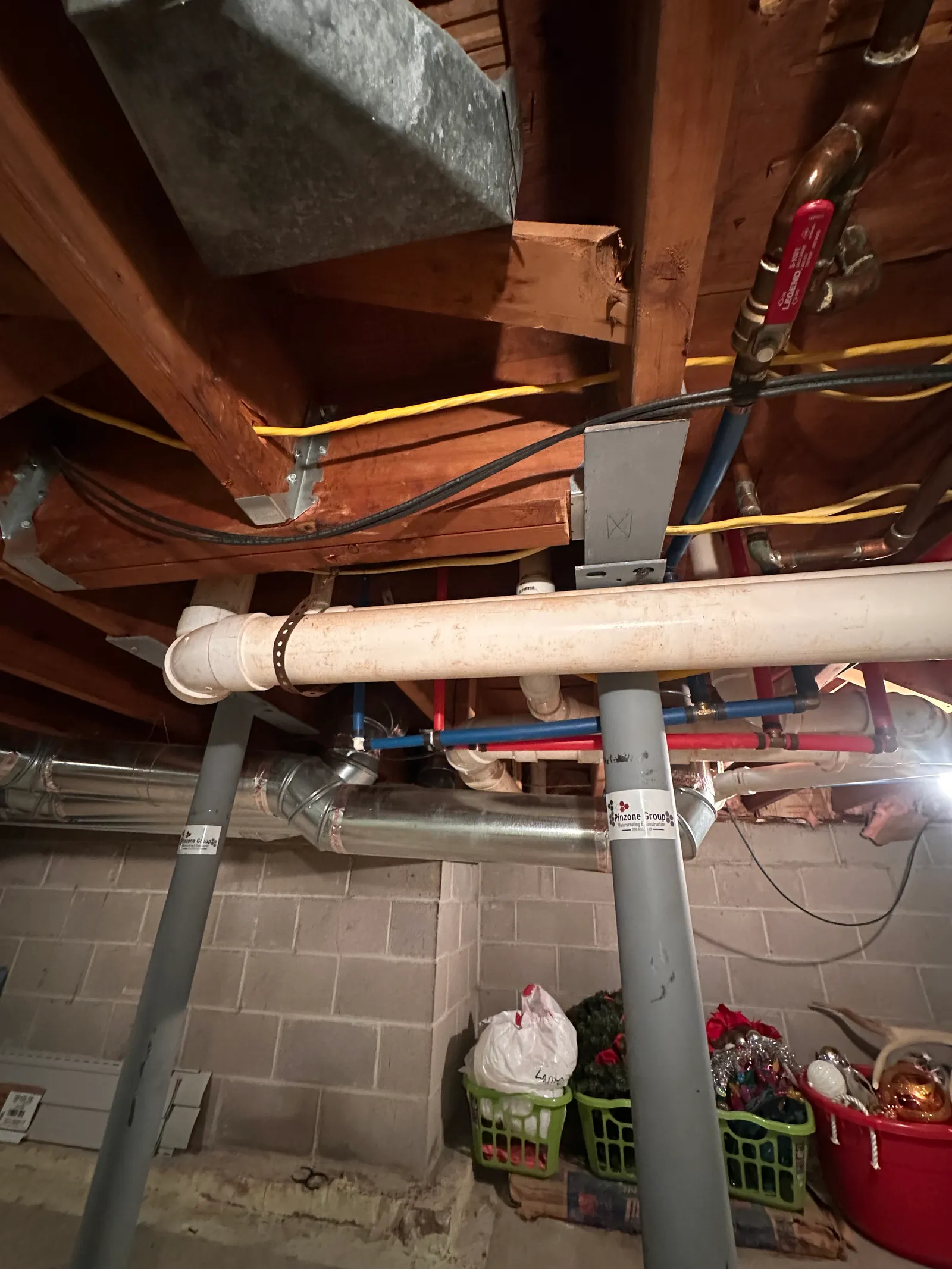 Detail of steel column top plate meeting beam with utilities overhead