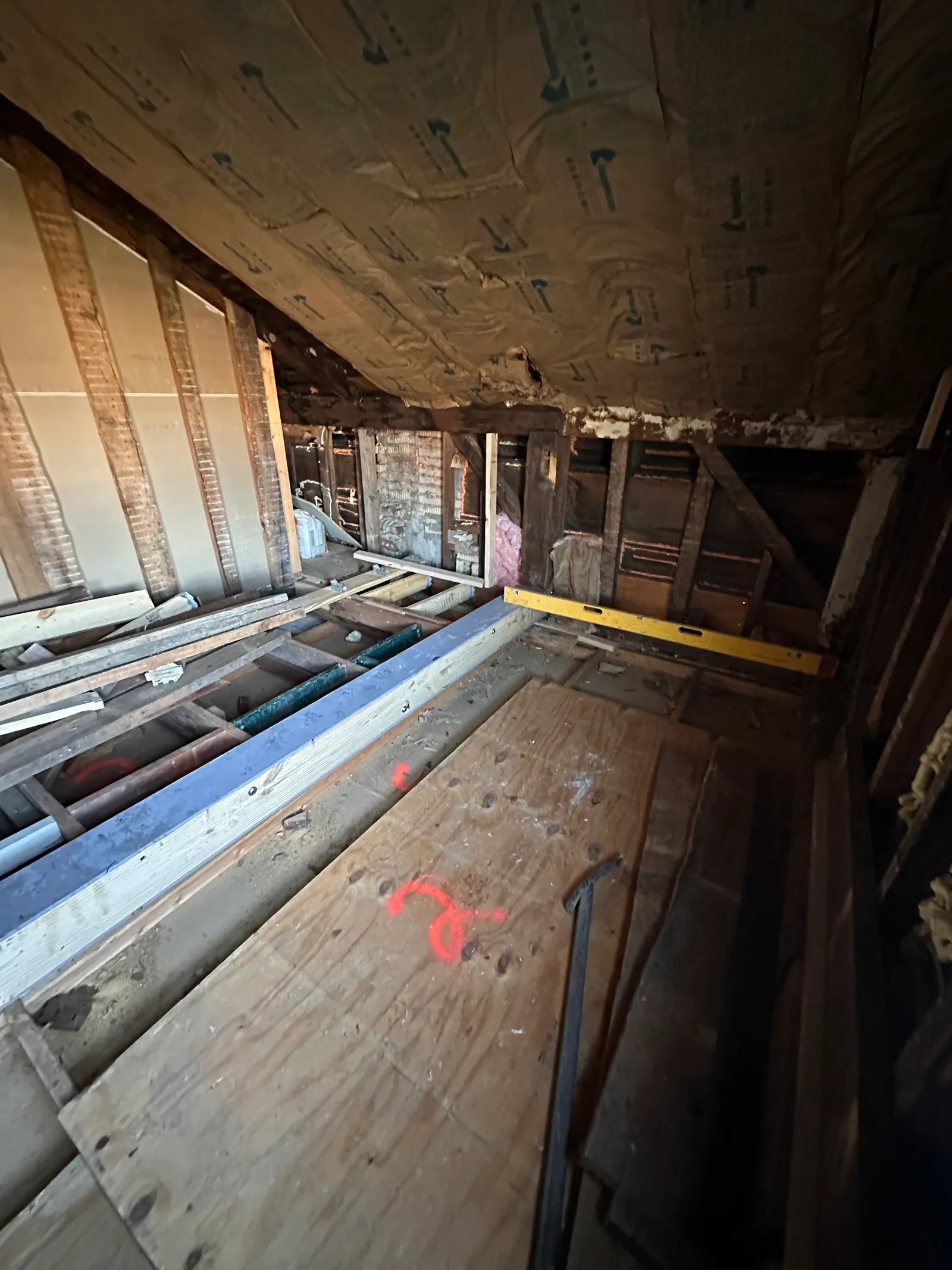 Spirit level on newly installed steel beam verifying level placement