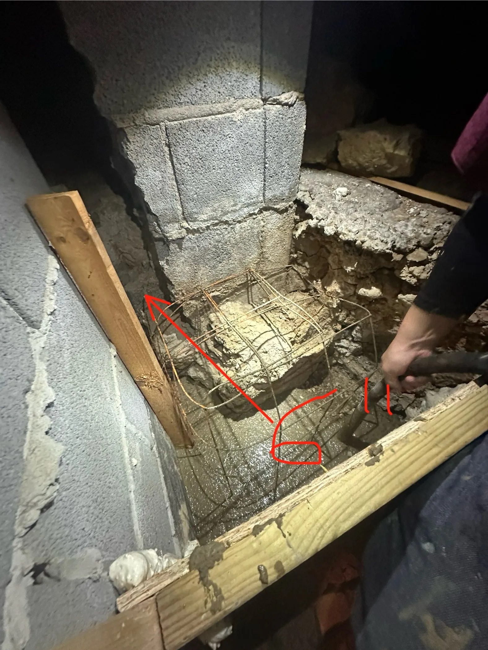 Annotated detail of rebar cage at CMU block pier base during footing repair
