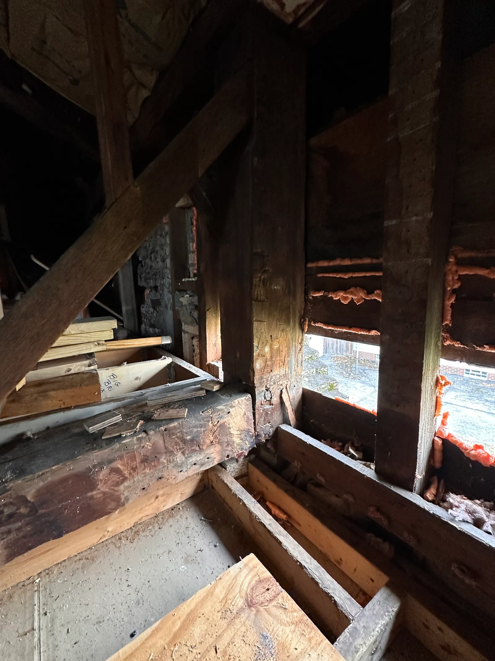 Severely deteriorated sill plate and rim joist with rot and water damage