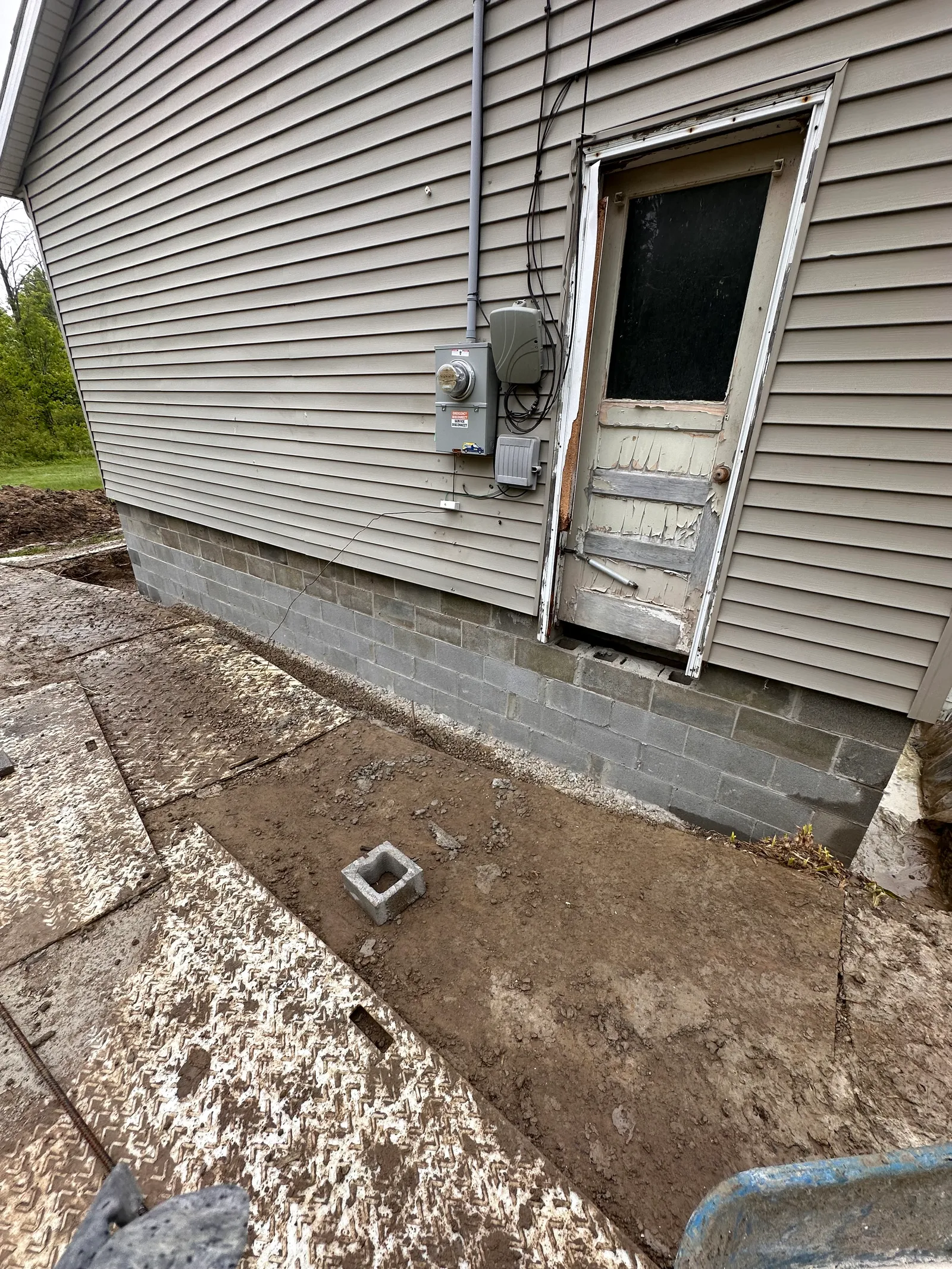Newly constructed CMU block foundation wall on home exterior in Cleveland
