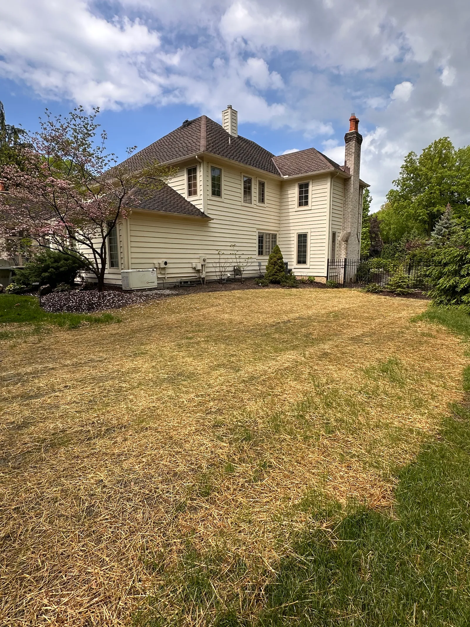 Residential home exterior before foundation repair — Cleveland, OH