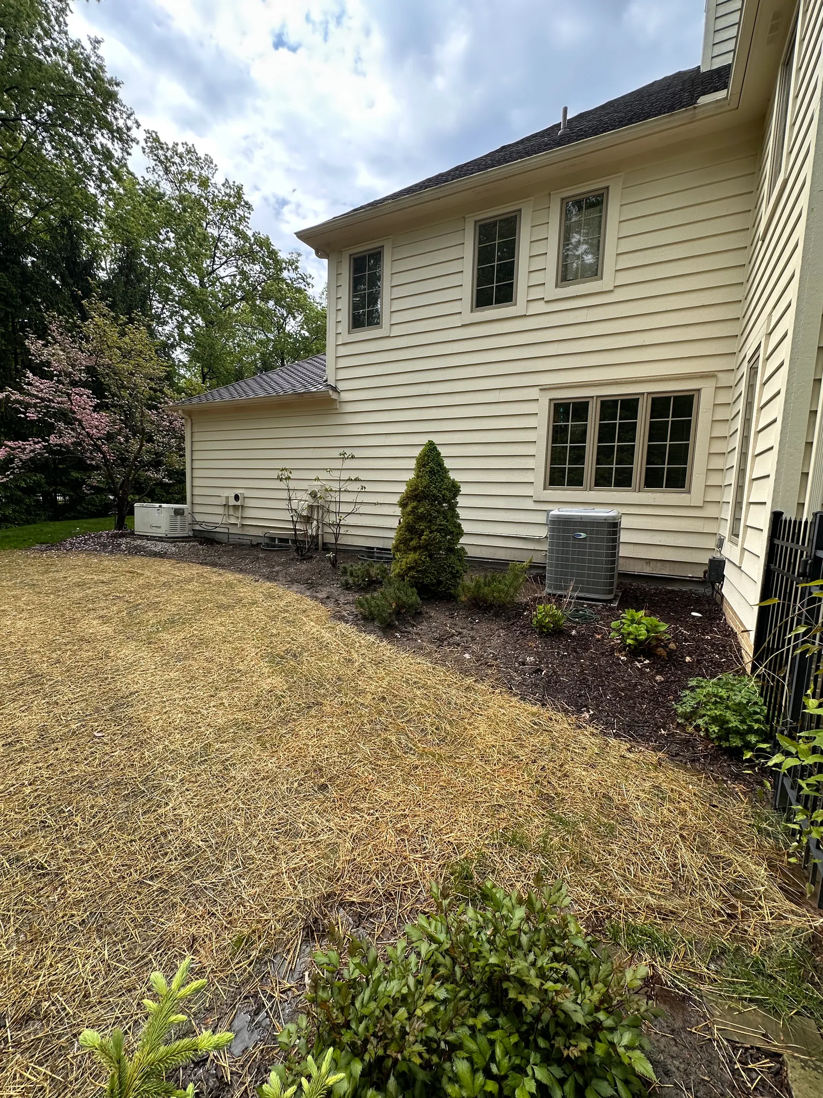 Side view of residential property showing foundation line before repair work
