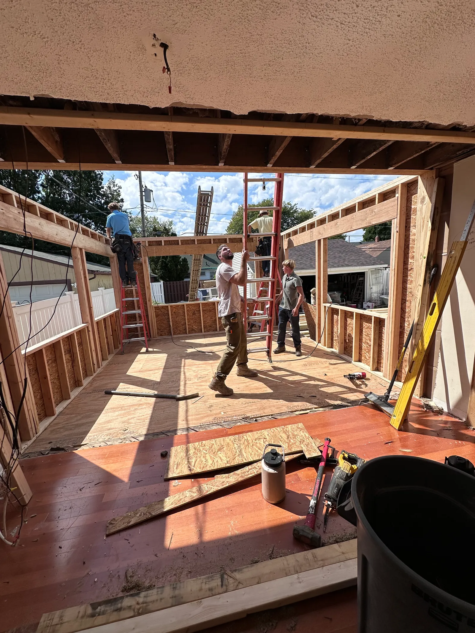 Fully completed structural addition — front exterior with new siding and trim