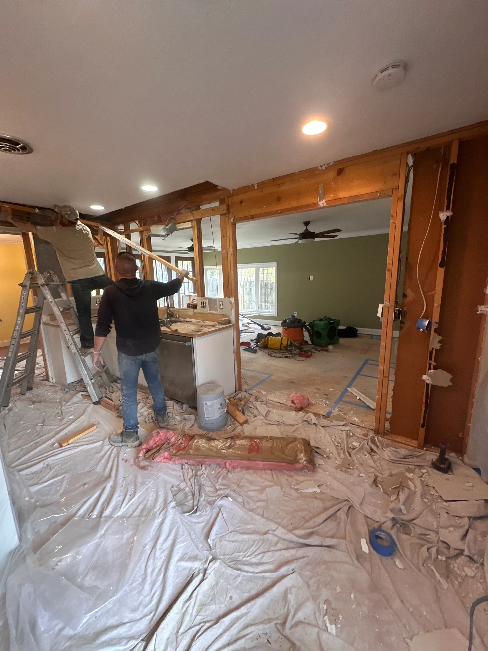 Interior structural framing and beam preparation during renovation