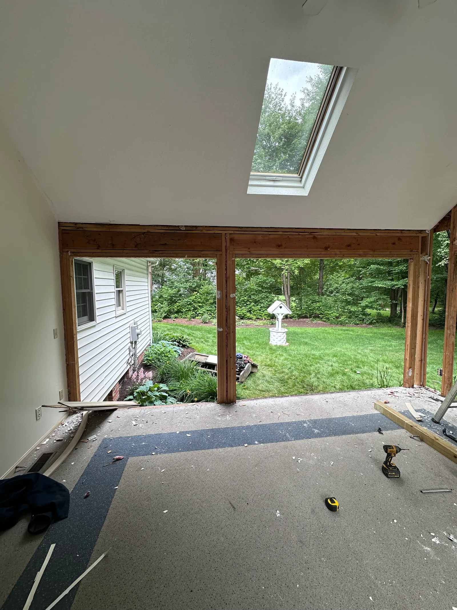 Structural wall removal in vaulted sunroom with exposed framing